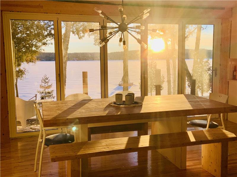 Sunny waterfront cottage with big panoramic sliding door and big dock
