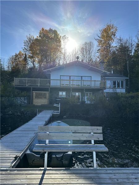 Your ultimate lakefront retreat: Cozy cottage with private spa, sauna, hot tub, and fireplace