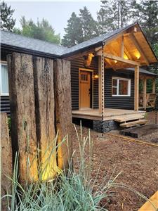 Scandinavian log cabin steps from the village of Saint-Sauveur