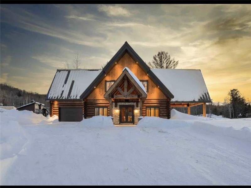 Chaleureux chalet en bois rond La Tanière, bord de lac, face aux pistes de ski